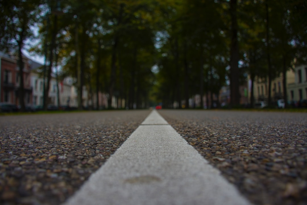 Some friends and I were walking through the streets of Utrecht when I saw this long straight road and I wanted to take a photo of it. I had to hurry because there were coming cars.